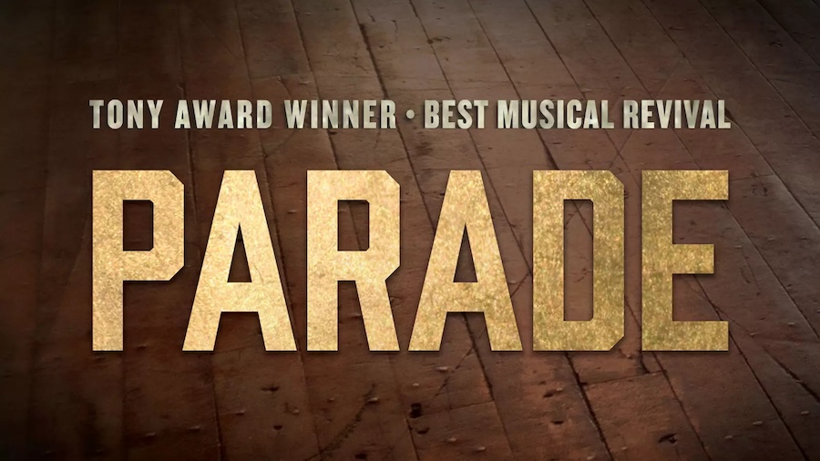 Bold golden text reads “Parade” above a wooden floor, promoting the Tony Award-winning musical.